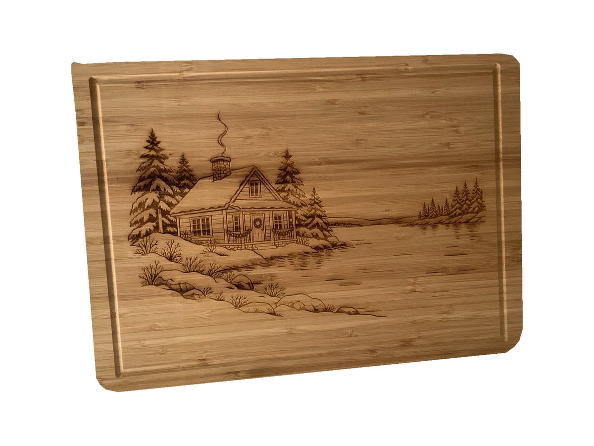 Christmas Cabin bamboo serving board on white background, alternate angle.
