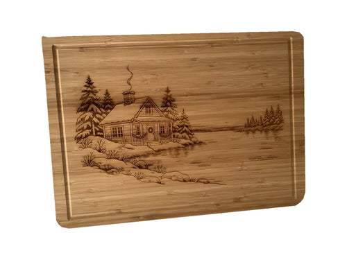 Christmas Cabin bamboo serving board on white background, alternate angle.
