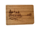 Christmas Cabin bamboo serving board on white background, straight-on view.