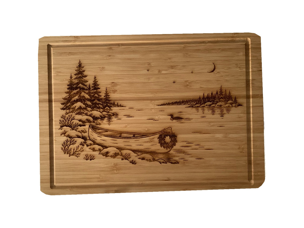 Christmas Canoe bamboo serving board on white background, alternate angle.
