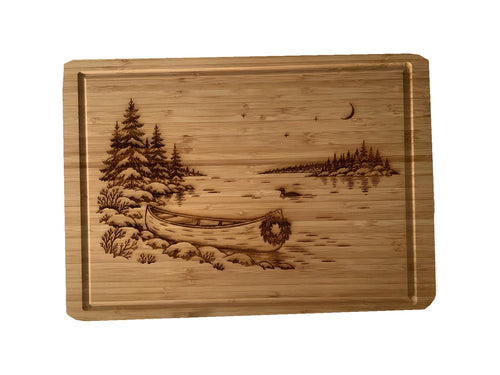 Christmas Canoe bamboo serving board on white background, alternate angle.