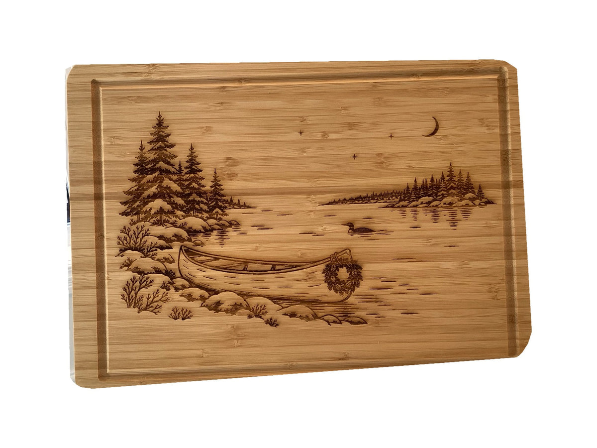 Christmas Canoe bamboo serving board on white background, straight-on view.