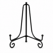 Black metal folding display stand with decorative scroll feet