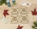 Wooden coasters with 'Nobody cares what you folded' text on a table.