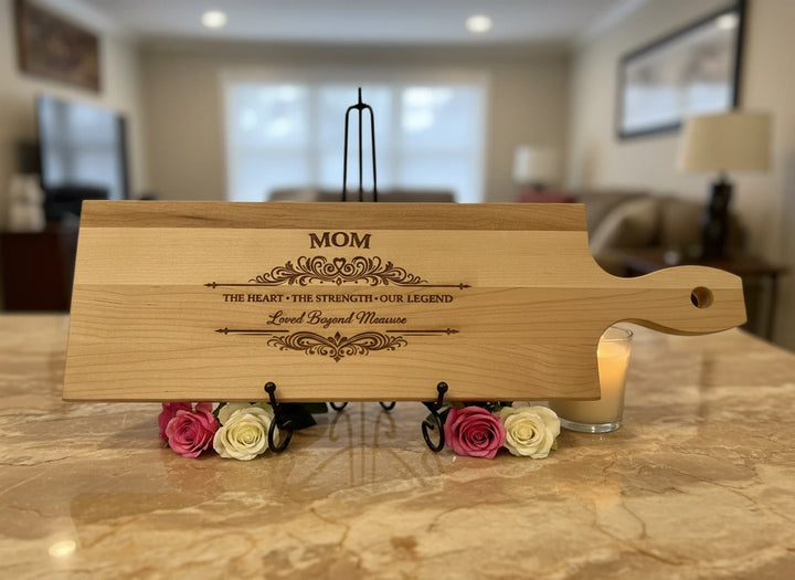 Personalized wood serving board with an engraved design for Mom.