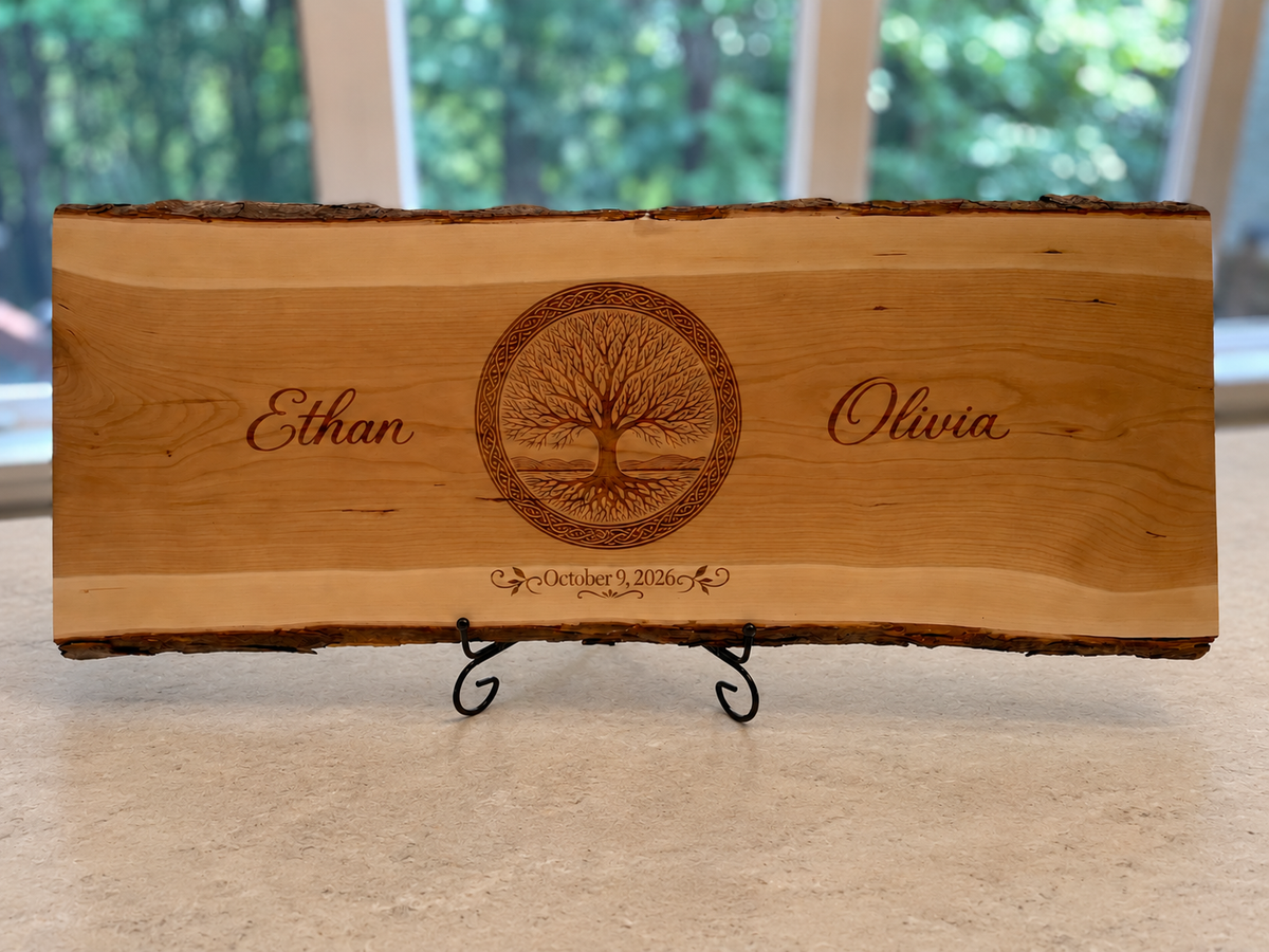 Ethan and Olivia engraved live-edge board displayed by a window on a neutral stone surface