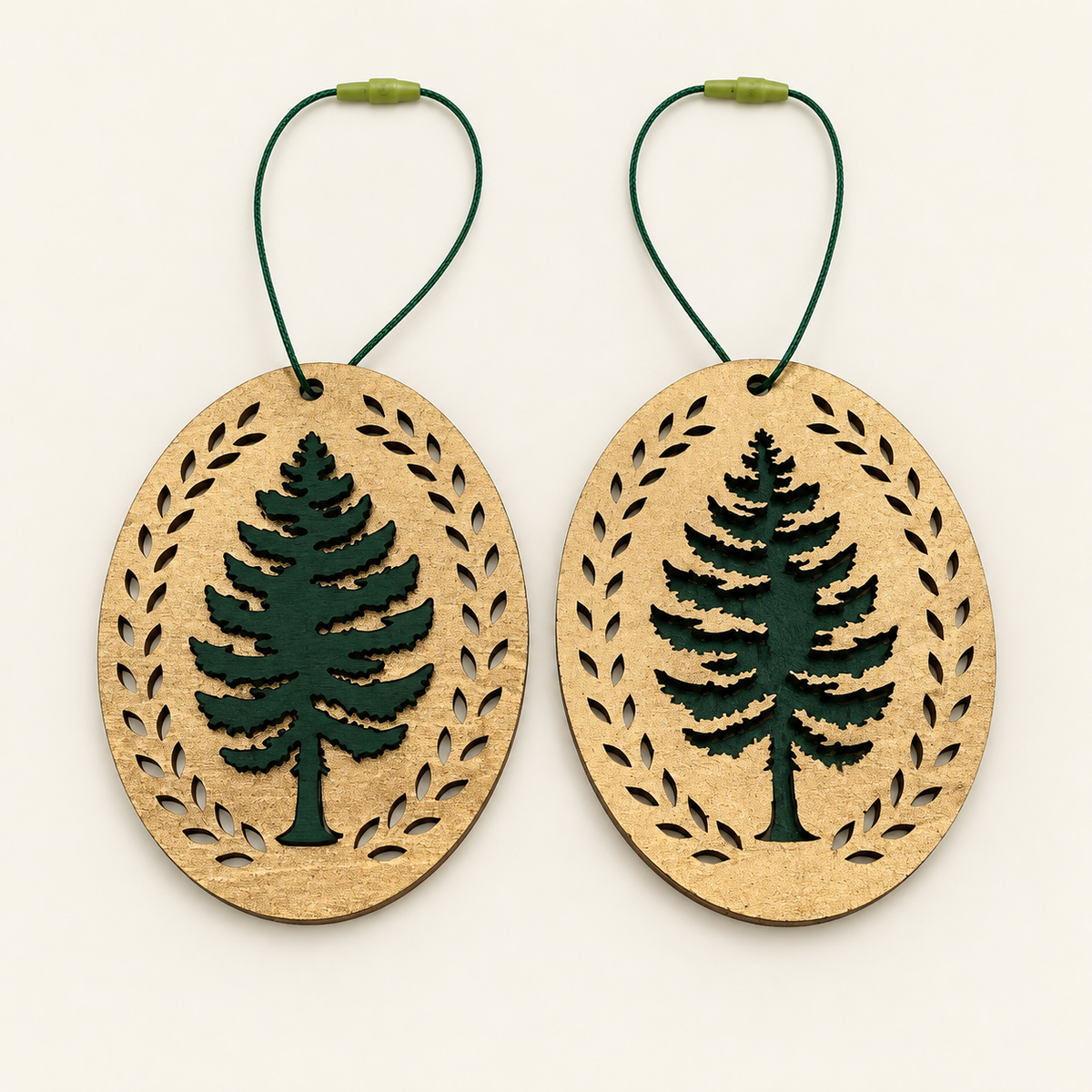 Front and back of a gold and green layered wood evergreen Christmas ornament