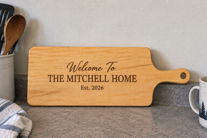 Personalized serving board engraved with a family name and established year