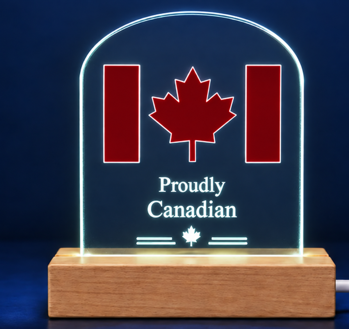 Proudly Canadian acrylic LED display with clear illuminated edges on a dark blue background