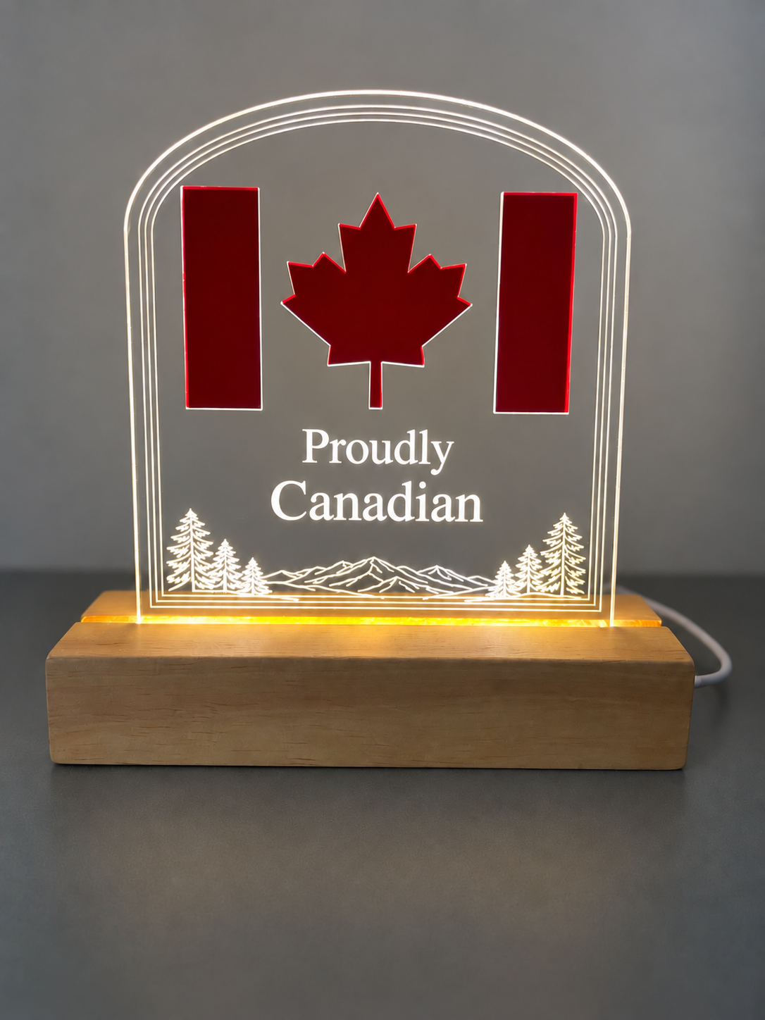 Redesigned Proudly Canadian acrylic LED display with warm illuminated wood base