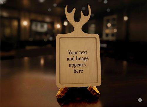 A personalized wooden sign with a deer head silhouette at the top and placeholder text 'Your text and Image appears here', displayed on a small wooden easel in a dimly lit bar or restaurant setting.