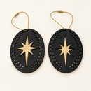 Front and back of a black and gold layered wood star Christmas ornament